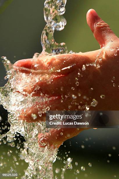 Girls plays with the water during the Dow Live Earth Run for water at The Docklands on April 18, 2010 in Melbourne, Australia.