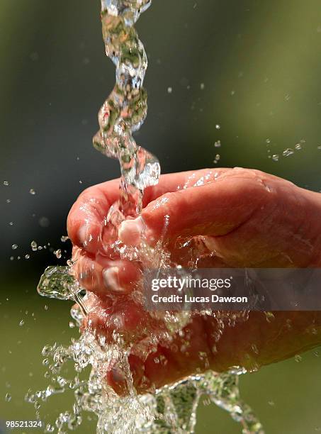 Girls plays with the water during the Dow Live Earth Run for water at The Docklands on April 18, 2010 in Melbourne, Australia.