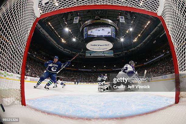 Christian Ehrhoff of the Vancouver Canucks celebrates the goal by team mate Mikael Samuelsson in Game Two of the Western Conference Quarterfinals...