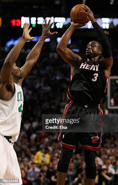 Dwyane Wade of the Miami Heat takes a shot as Tony Allen of the Boston Celtics defends during Game One of the Eastern Conference Quarterfinals of the...