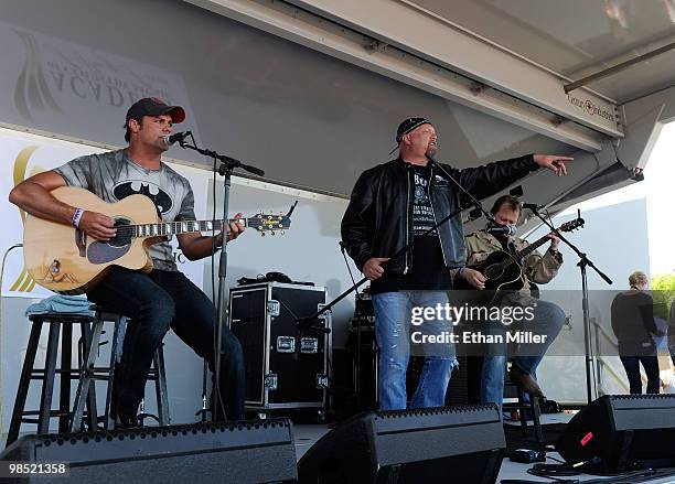 Singers Troy Gentry and Eddie Montgomery of the duo Montgomery Gentry perform onstage during the Academy Of Country Music's USO concert at Nellis Air...