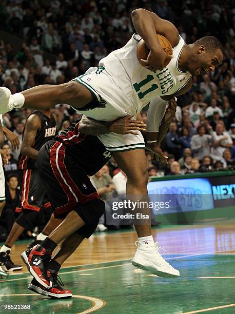 Glen Davis of the Boston Celtics is fouled by Udonis Haslem of the Miami Heat during Game One of the Eastern Conference Quarterfinals of the 2010 NBA...