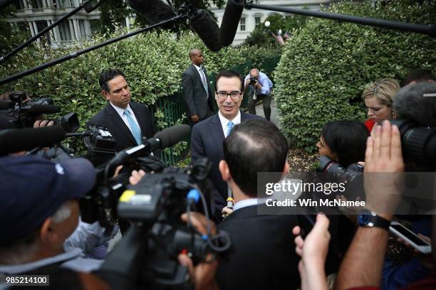 Treasury Secretary Steven Mnuchin answers questions from the media outside the White House June 27, 2018 in Washington, DC. Mnuchin fielded a range...