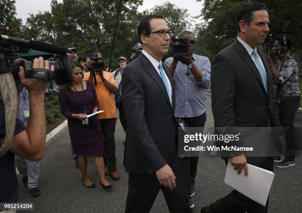 Treasury Secretary Steven Mnuchin departs after answering questions from the media outside the White House June 27, 2018 in Washington, DC. Mnuchin...