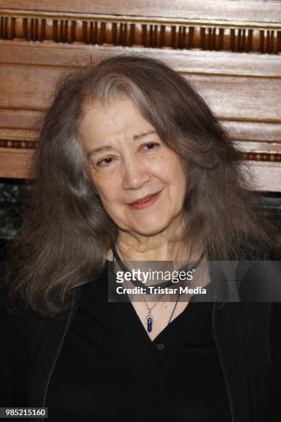 Swiss-Argentinian pianist Martha Argerich signs the golden book at Hamburg City Hall on June 27, 2018 in Hamburg, Germany.