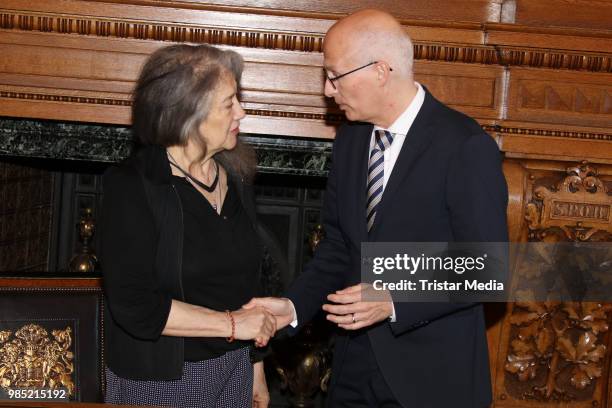 Swiss-Argentinian pianist Martha Argerich and Peter Tschentscher, mayor of Hamburg during she signs the golden book at Hamburg City Hall on June 27,...