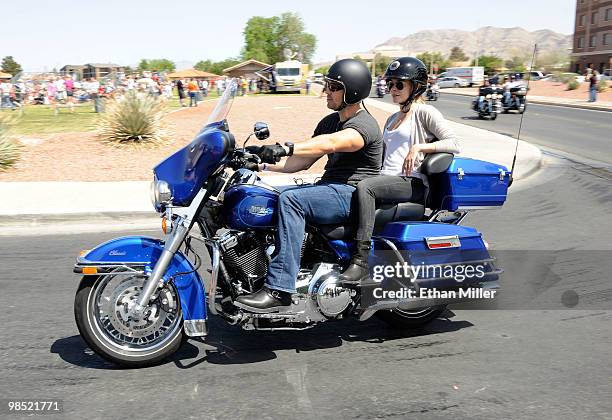 Eddie Cibrian and singer LeAnn Rimes arrive during the Chairman's Ride at the Academy Of Country Music's USO concert at Nellis Air Force Base on...