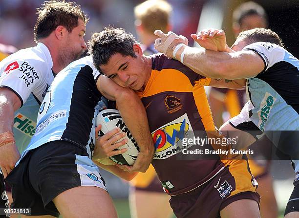 Corey Parker of the Broncos takes on the defence during the round six NRL match between the Brisbane Broncos and the Cronulla Sharks at Suncorp...