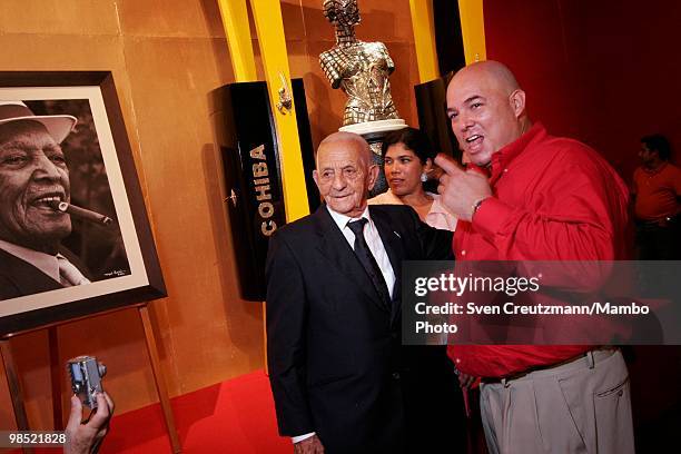 Cuba`s most famous tobacco grower, Alejandro Robaina poses for a photo with Alex Castro , son of Cuba`s Revolution leader Fidel Castro, during the...