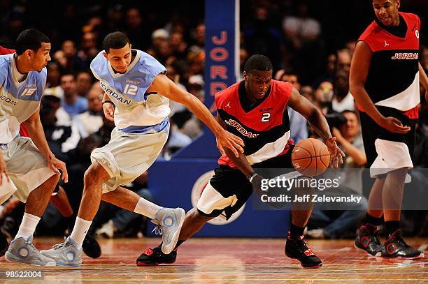 Kendall Marshall of West Team and Dion Waiters of East Team fight for a loose ball during the National Game at the 2010 Jordan Brand classic at...