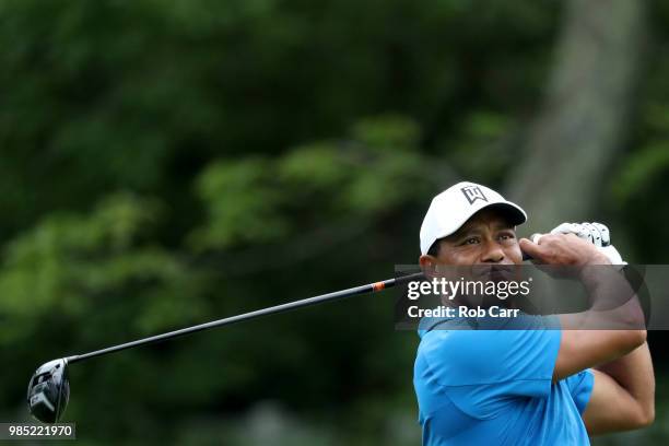 Tiger Woods follows his tee shot on the sixth hole in the Pro-Am prior to the Quicken Loans National at TPC Potomac on June 27, 2018 in Potomac,...