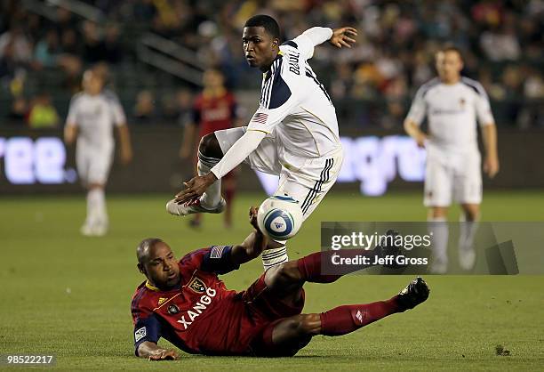 Jamison Olave of Real Salt Lake tackles Edson Buddle of the Los Angeles Galaxy in the second half at the Home Depot Center on April 17, 2010 in...