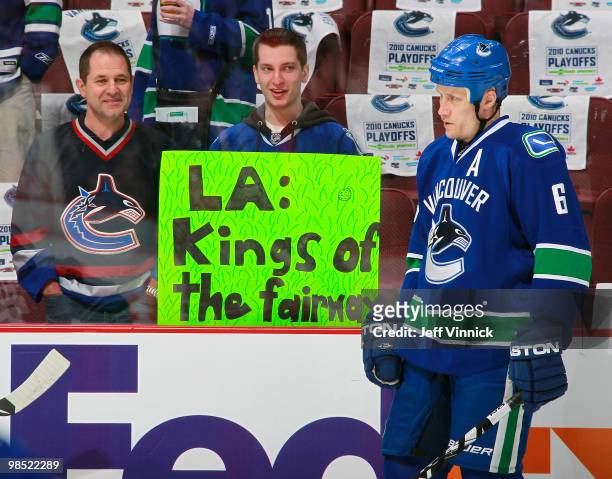 Sami Salo of the Vancouver Canucks looks on as fans hold up a sign making fun of the L.A. Kings in Game Two of the Western Conference Quarterfinals...