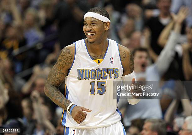 Carmelo Anthony of the Denver Nuggets celebrates after sinking a shot against the Utah Jazz during the second half of Game One of the Western...