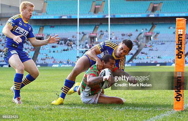 Fetuli Talanoa of the Rabbitohs scores a try as Jarryd Hayne of the tackles during the round six NRL match between the Parramatta Eels and the South...