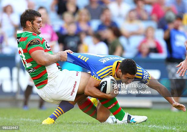 David Taylor of the Rabbitohs pulls Jarryd Hayne of the Eels into the in goal during the round six NRL match between the Parramatta Eels and the...