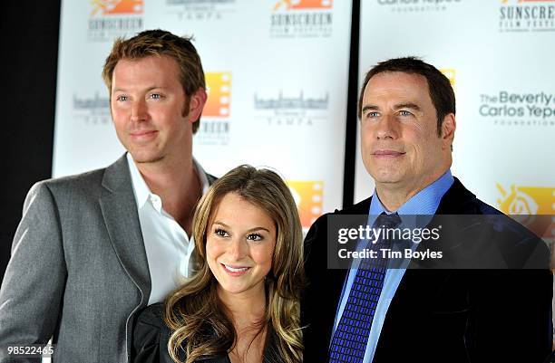John Travolta poses with producer Sean Covel and Alexa Vega at the Sunscreen Film Festival awards ceremony at the Mirror Lake Lyceum on April 17,...