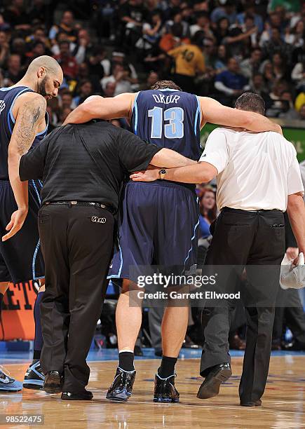 Mehmet Okur of the Utah Jazz is carried off after a ankle injury against the Denver Nuggets in Game One of the Western Conference Quarterfinals...