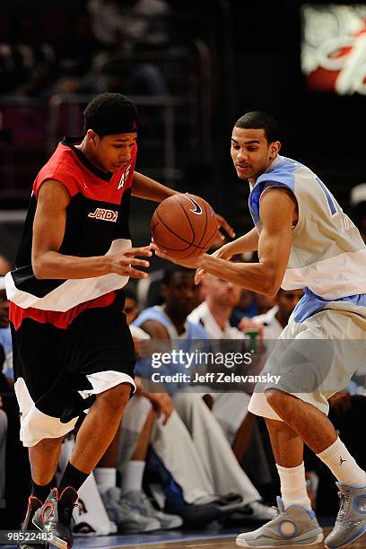 Jelan Kendrick of East team and Cory Joseph of West Team reach for the ball during the National Game at the 2010 Jordan Brand classic at Madison...