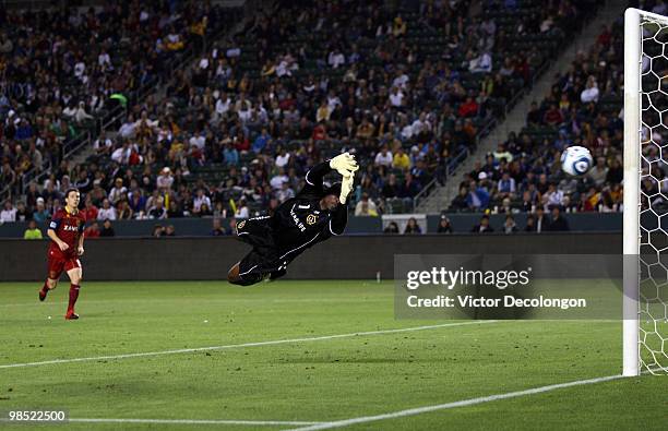 Goalkeeper Donovan Ricketts of the Los Angeles Galaxy dives to his left as the ball bounces off the post and back out on a shot on goal by Real Salt...