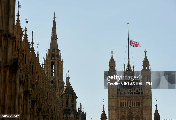 The British union flag flies at half-mast above the Victoria Tower on the Palace of Westminster, in central London on July 3, 2015. Britain's Queen...
