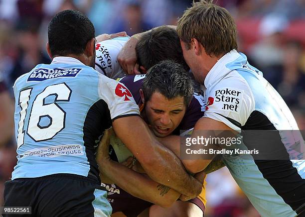 Corey Parker of the Broncos takes on the defence during the round six NRL match between the Brisbane Broncos and the Cronulla Sharks at Suncorp...