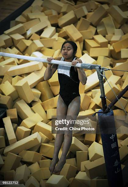 An athlete attends a training session during the 2010 Training Camp For Country's Reserve Gymnastic Athletes at the Gymnastic Hall of Hubei Olympic...