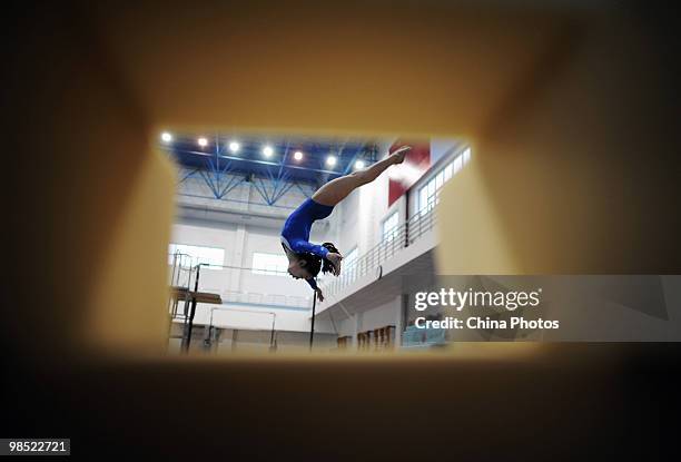 An athlete attends a training session during the 2010 Training Camp For Country's Reserve Gymnastic Athletes at the Gymnastic Hall of Hubei Olympic...