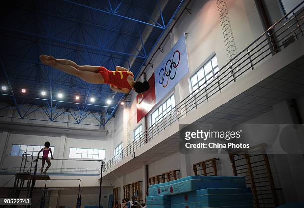 An athlete attends a training session during the 2010 Training Camp For Country's Reserve Gymnastic Athletes at the Gymnastic Hall of Hubei Olympic...