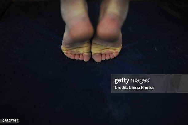 An athlete attends a training session during the 2010 Training Camp For Country's Reserve Gymnastic Athletes at the Gymnastic Hall of Hubei Olympic...