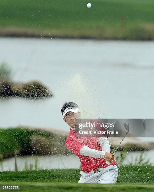 Yang of Korea plays a bunker shot on the 1st hole during the Round Four of the Volvo China Open on April 18, 2010 in Suzhou, China.