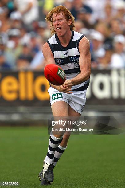 Cameron Ling of the Cats handballs during the round four AFL match between the Geelong Cats and the Port Adelaide Power at Skilled Stadium on April...