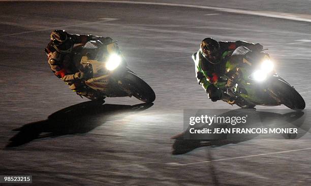 French Gregory Leblanc rides his Kawasaki N°11 ahead of French Gwen Giabbani on his Yamaha N°1 during the 33rd edition of the Le Mans 24-Hour...