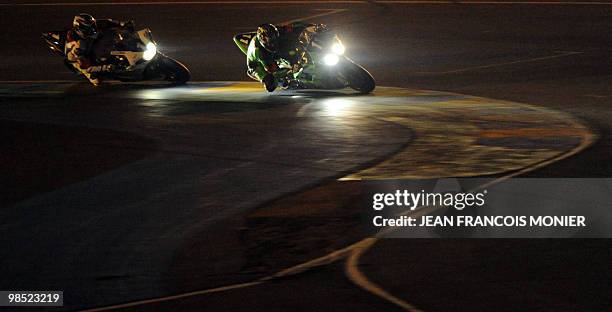 French Gregory Leblanc rides his Kawasaki N°11 ahead of French Gwen Giabbani on his Yamaha N°1 during the 33rd edition of the Le Mans 24-Hour...