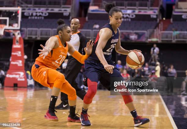 Washington Mystics guard Kristi Toliver screens the ball from Connecticut Sun guard Alex Bentley during a WNBA game between the Washington Mystics...