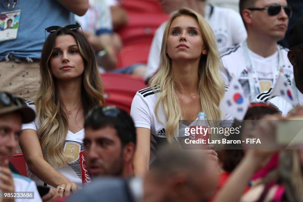 Matthias Ginter of Germany's wife, Christina Ginter, and Marco Reus of Germany's girlfriend Scarlett Gartmann look on during the 2018 FIFA World Cup...