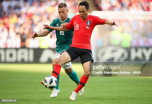 Joshua Kimmich of Germany competes with Seonmin Moon of Korea Republic during the 2018 FIFA World Cup Russia group F match between Korea Republic and...