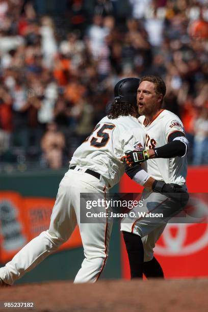 Hunter Pence of the San Francisco Giants is congratulated by Brandon Crawford after hitting a two run walk off double against the San Diego Padres...