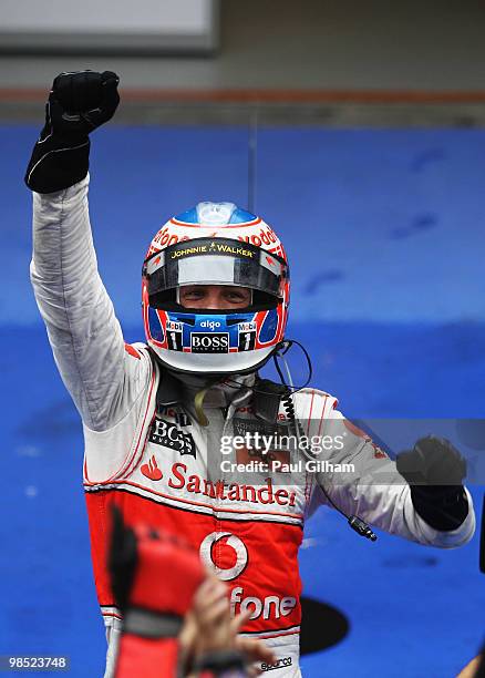 Jenson Button of Great Britain and McLaren Mercedes celebrates in parc ferme after winning the Chinese Formula One Grand Prix at the Shanghai...