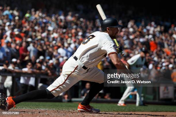 Hunter Pence of the San Francisco Giants hits a two run walk off double against the San Diego Padres during the eleventh inning at AT&T Park on June...