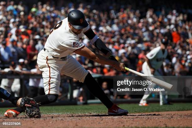 Hunter Pence of the San Francisco Giants hits a two run walk off double against the San Diego Padres during the eleventh inning at AT&T Park on June...