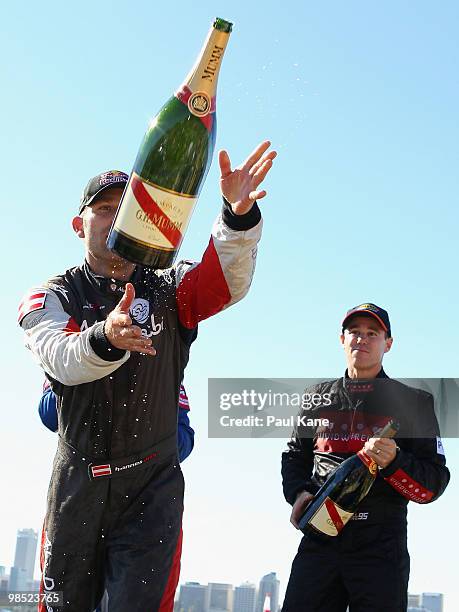 Matt Hall of Australia celebrates his 2nd, Hannes Arch of Austria his 1st place on the podium after the Red Bull Air Race Day on April 18, 2010 in...