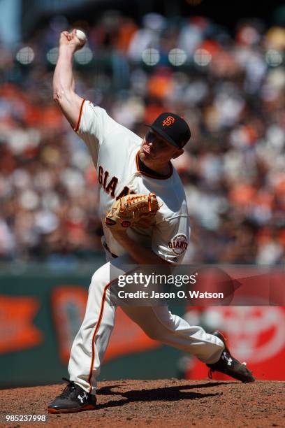 Mark Melancon of the San Francisco Giants pitches against the San Diego Padres during the eighth inning at AT&T Park on June 24, 2018 in San...