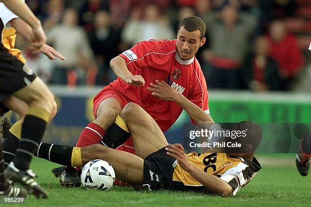 Steve Watts of Leyton Orient is tackled by Justin Whittle of Hull during the Nationwide Division Three Play Off Semi Final Second Leg between Leyton...