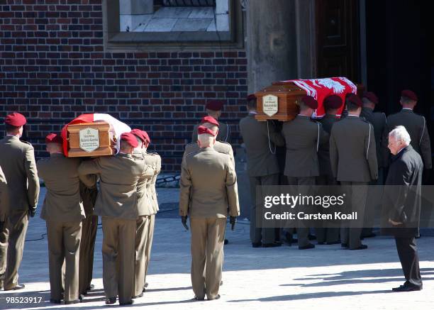 Soldiers carry the coffins of late Polish President Lech Kazcynski and his wife Maria to the St Mary's Basilica on April 18, 2010 in Krakow, Poland....