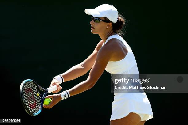 Arina Rodionova of Australia serves during her ladies singles qualifying match against Elena-Gabriela Ruse of Romania on Day Three of Wimbledon...