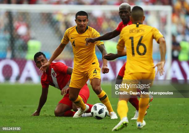 Tim Cahill of Australia battles for the ball with Aldo Corzo and Luis Advincula of Peru during the 2018 FIFA World Cup Russia group C match between...