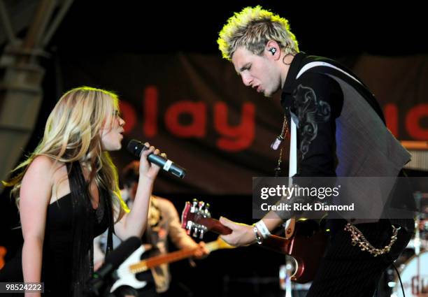 Musicians Cheyenne Kimball and Mike Gossin of the band Gloriana performs onstage at the 45th Annual Academy of Country Music Awards concerts at the...