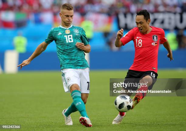 Joshua Kimmich of Germany is challenged by Seonmin Moon of Korea Republic during the 2018 FIFA World Cup Russia group F match between Korea Republic...