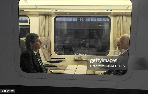 Czech Republic's President Vaclav Klaus talks with the Czech Prime Minister Jan Fischer in the train in Prague on April 18, 2010 prior to their...